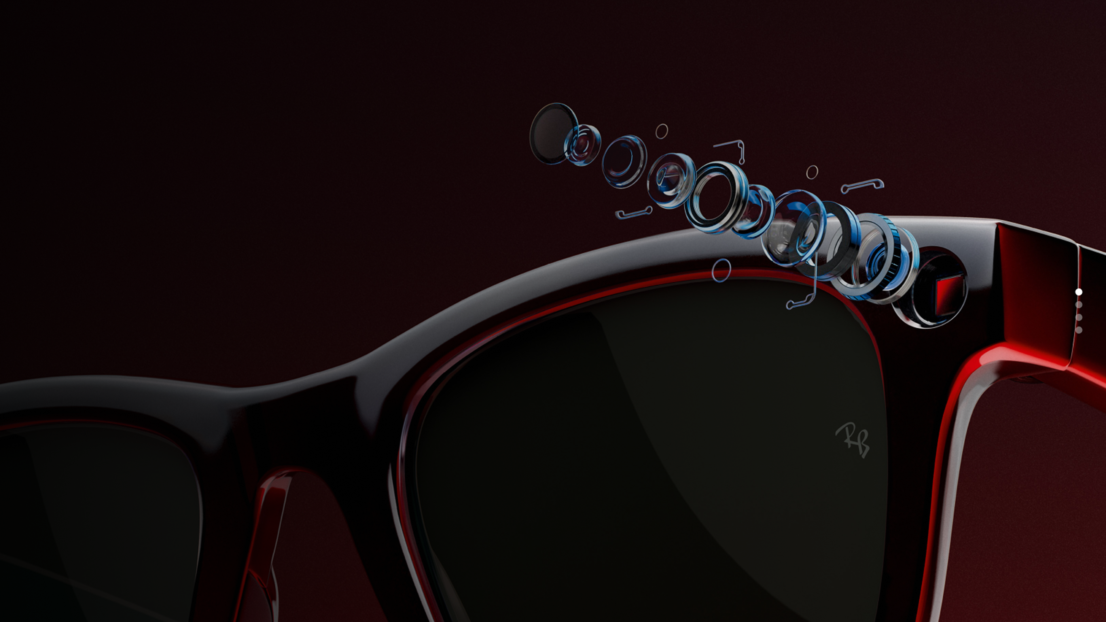 two people sitting on a ledge talking